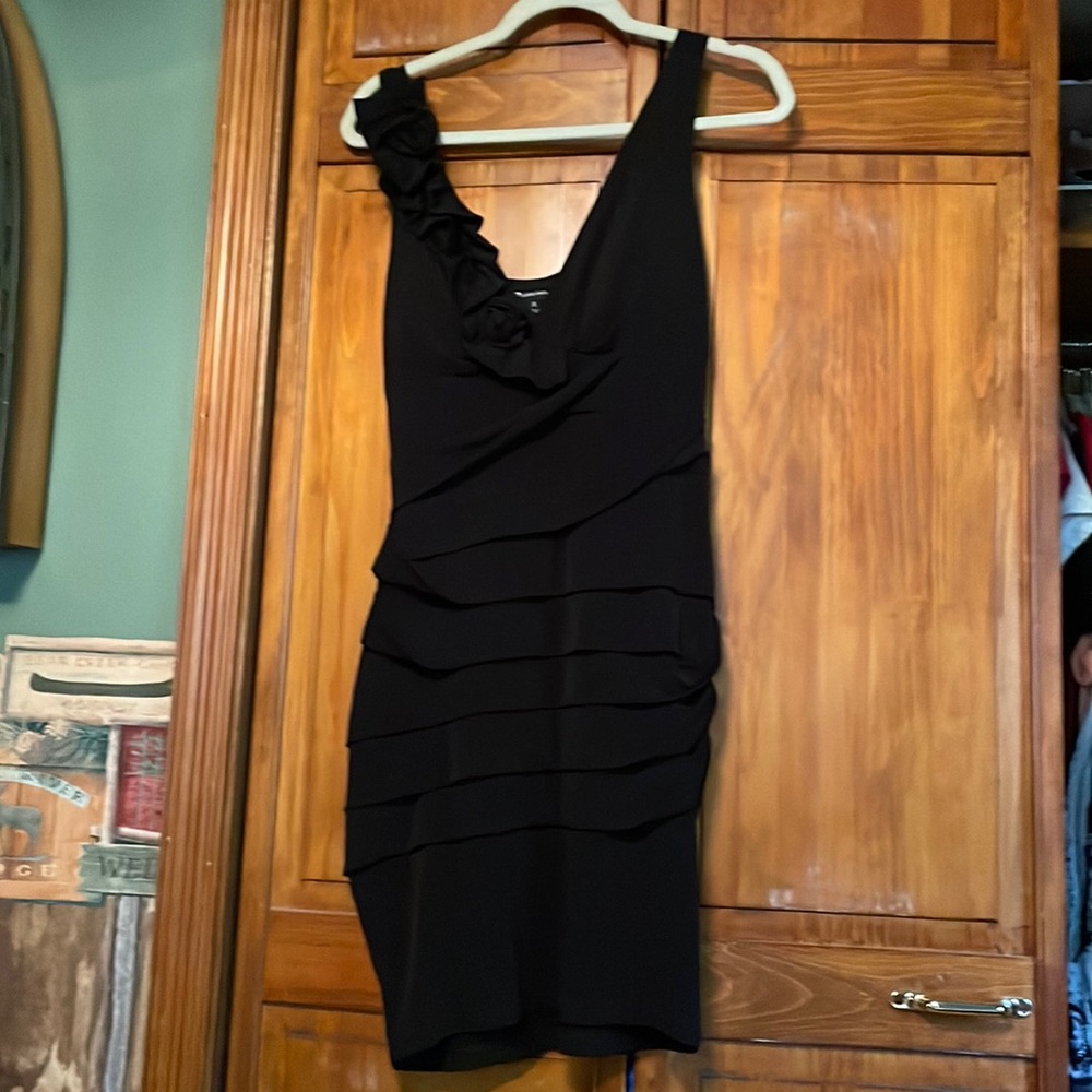Black cocktail dress with ruffled details